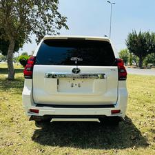 Toyota LandCruiser Prado TX  limited 2700cc (eco pro)
Model 2019/11 import  from japan April 2024 
Pearl white with beige leather interior 
Mileage  38000 km
Auction grade 4.5 A ( spotless condition)
7 seater  leather with sunroof 
Parktronic sensors & adopted Radar 
B&O sound system with 360 degrees cameras  front & rear 
Ambient lights
Wooden steering wheel  & full wooden interior 
Remote control smart starring & climate control access.
LED Xinon headlights with electric washers
Full body kit modilista & sport side skirts foot panels.
Crome package 
Full sports body kit available in the suv .
Further information please contact 11am to 10 pm & physically visit at Victory Cars jail road Lahore.