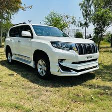 Toyota LandCruiser Prado TX  limited 2700cc (eco pro)
Model 2019/11 import  from japan April 2024 
Pearl white with beige leather interior 
Mileage  38000 km
Auction grade 4.5 A ( spotless condition)
7 seater  leather with sunroof 
Parktronic sensors & adopted Radar 
B&O sound system with 360 degrees cameras  front & rear 
Ambient lights
Wooden steering wheel  & full wooden interior 
Remote control smart starring & climate control access.
LED Xinon headlights with electric washers
Full body kit modilista & sport side skirts foot panels.
Crome package 
Full sports body kit available in the suv .
Further information please contact 11am to 10 pm & physically visit at Victory Cars jail road Lahore.