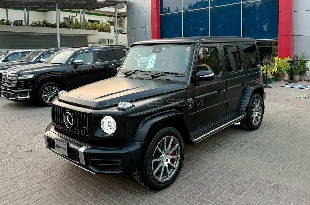 Mercedes Benz G63 AMG
V8 4.0 litre Biturbo
Model year 2020
Manufacturing Year 2019 end 
Fresh Import 2024
Milage 19000km 
Japan import
Satin black colour with red napa leather interior 


OPTIONS
•Active Lane Keeping Assist
•Red AMG brake callipers 
•Blind Spot Monitor
•Driver Assistance package Plus
•Smartphone integration CarPlay
•Sunroof
•Ambient lighting 
•Digital instrument cluster 
•360° camera
•Wider wheel arch for AMG wheels
•Parking package
•Switchable exhaust system
•AMG Performance steering wheel
•AMG Speedshift Plus 9G-Tronic
and many more options

Calling and Visiting Hours

Monday to Saturday

11:00 AM to 7:00 PM