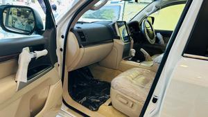 Toyota LandCruiser AX-G V8 4500cc
Model 2020 , fresh import March 2025
Mileage 29000 km , 
Auction grade 4.5 
Pearl White metallic with beige nappa leather interior ( new shade 2020 )
Brand new condition ( spotless)
Sunroof 
Leather multi power electric seats 
Electric Cool box 
8 zone climate control dual air conditioning 
Adapter cruise control 
Adapted Radar & line accessed 
Full wooden interior with ambient interior lighting 
Adaptive led all climate headlamps 
Tasla monitor installed  with android apps, Apple CarPlay & active navigation 
Full ZX customised fittings 
20” alloy wheels 
Full Crome package 
Full original factory fitted Modulista body kit 
Further information please call & visit at Victory Cars jail road Lahore.