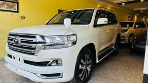 Toyota LandCruiser AX-G V8 4500cc
Model 2020 , fresh import March 2025
Mileage 29000 km , 
Auction grade 4.5 
Pearl White metallic with beige nappa leather interior ( new shade 2020 )
Brand new condition ( spotless)
Sunroof 
Leather multi power electric seats 
Electric Cool box 
8 zone climate control dual air conditioning 
Adapter cruise control 
Adapted Radar & line accessed 
Full wooden interior with ambient interior lighting 
Adaptive led all climate headlamps 
Tasla monitor installed  with android apps, Apple CarPlay & active navigation 
Full ZX customised fittings 
20” alloy wheels 
Full Crome package 
Full original factory fitted Modulista body kit 
Further information please call & visit at Victory Cars jail road Lahore.