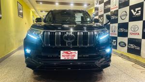 Toyota LandCruiser Prado TXL 2700cc eco/pro.
Model 2020 import April 2025
Brand New vehicle ( spotless condition )
Mileage 49000 km
Auction grade 4.5 A 
Silky black with ash white interior 
Top of the line specs,
All 7seats nappa leather 
Heated & ventilated ( air conditioning) seat 
Glass electric sunroof 
All zone climate control air conditioning 
Adapted Radar 
Active line accessed & blind spot monitor.
Adaptive cruise control 
Premium sound system with 16 speakers 
Cool box 
Full trd original body kit 
19” alloy wheels 
Crome package 
Further information please call & visit at Victory Cars jail road Lahore