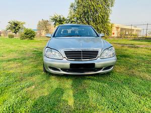 Mercedes-Benz S350 3700cc V6
Model 2004 ( production 2003/12 )
Import from Japan 2007 registered 2010 in Islamabad 
First owner driven 
Mileage  72000
Excellent condition ( original paint & spotless)
Metallic silver colour & black nappa leather interior.
Top of the line specs.
Sunroof, multi power seats, heated seats, massager seats, electric curtains, aromatic suspension, Xinon headlights, electric boot, cool box , premium sound system. Duel climate control air conditioning.
Further information please call & visit at Victory Cars jail road Lahore