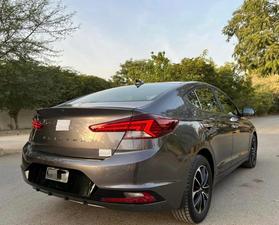 HYUNDAI ELANTRA GLS TOP OF THE LINE NEW RIMS (2000cc)
Model 2021 December || Registered 2022
Only 25,300 KM 100% Genuine 
Hyundai South Maintained 
Cyber Grey Color 
Bumper to bumper original guaranteed 100 %
TOP OF THE LINE
Original NEW TV Back Cam
Original NEW Leather Seats
Original NEW RIMS
Sunroof 
Wireless Charger
Dual Power Seats
Spare Wheel Unused 
Fog lights
Just Like Zero Meter 
All seals still intact 
See to Believe 
Ready Delivery 
EXCHANGE POSSIBLE WITH ANY CAR

For inspection
Available at SUPREME CARS
Plot # 151/F,Under Imam heights,Shop no.1&2, Main Khalid Bin Walid Rd, Karachi, Sindh 75400

|  Premium Cars  |  Best Prices  |  Optimum Performance | 
#supremecarsgang