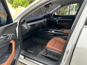 AUDI ETRON 50 QUATTRO TOP OF THE LINE (230KW)
Model 2022 || Registration 2022 
Choice Registered *800*
10,000 miles Driven 
Audi Maintained 
White Color
Bruno Interior
Bumper to Bumper Original Paint 100%
Scratch-less & Spotless
FULL HOUSE 
Just as good as Brand New   
Original TV 
Original Rims 
Still Smells like zero meter 
SEE TO BELIEVE 
READY DELIVERY 
EXCHANGE POSSIBLE WITH ANY CAR

For inspection
Available at SUPREME CARS
Plot # 151/F,Under Imam heights,Shop no.1&2, Main Khalid Bin Walid Rd, Karachi, Sindh 75400

|  Premium Cars |  Best Prices |  Optimum Performance | 
#supremecarsgang