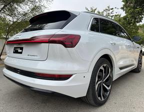 AUDI ETRON 50 QUATTRO TOP OF THE LINE (230KW)
Model 2022 || Registration 2022 
Choice Registered *800*
10,000 miles Driven 
Audi Maintained 
White Color
Bruno Interior
Bumper to Bumper Original Paint 100%
Scratch-less & Spotless
FULL HOUSE 
Just as good as Brand New   
Original TV 
Original Rims 
Still Smells like zero meter 
SEE TO BELIEVE 
READY DELIVERY 
EXCHANGE POSSIBLE WITH ANY CAR

For inspection
Available at SUPREME CARS
Plot # 151/F,Under Imam heights,Shop no.1&2, Main Khalid Bin Walid Rd, Karachi, Sindh 75400

|  Premium Cars |  Best Prices |  Optimum Performance | 
#supremecarsgang