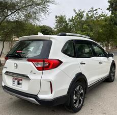HONDA BRV S PACKAGE TOP OF THE LINE NEW SHAPE PUSH START LIMITED EDITION(1500cc)
Model 2020 || Registered 2020
Only Genuine 28,000 KM
Taffeta White Color
Bumper to Bumper Original 100%
Guaranteed 
Scratch-less Spotless  
Push start
Centre console/ Hand-rest
Automatic Transmission
Original TV NAV
Climate Control
New Grill 
Original Fog Lights
Genuine Rims
Just like Zero Meter
All Seals Still Intact 
EXCHANGE POSSIBLE WITH ANY CAR

For inspection
Available at SUPREME CARS
Plot # 151/F,Under Imam heights,Shop no.1&2, Main Khalid Bin Walid Rd, Karachi, Sindh 75400

|  Premium Cars  |  Best Prices  |  Optimum Performance | 
#supremecarsgang