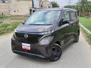 Fresh Import 
No.1 Japan Quality
G Edition
2023 Model
Shiny Brown Colour
Low Mileage 9995 km
Original Tv With Apple Car Play 
Adaptive Cruise Control 
100% Electric
20 kWh lithium-ion Battery	
Limited Edition 
Electric range 180 km According to 
Nissan Motor Corporation Japan 
Electronic Parking Break
Zero Emission
Push Start Engine / Intelligent Key
Auto Ac Touch Panel
LED Head Lump
Super UV Cut Doors Glass
Intelligent Around View Monitor
Genuine Verifiable Auction Sheet
Auction Sheet Attach For Satisfaction
9 Inch Navigation System
Back Camera
Remote Door Mirror
Abs Braking System
Traction Control
Hid Headlights
Retractable Side Mirrors With Indicators
Winker Mirror
Digital Climate Control Air Conditioning System
6 Air Bags for Perfect Safety
All Power Windows
Multimedia Steering
Engine In Clean & Good Condition
Clean Interior & Exterior
Power Steering
Dual SRS Air Bag
High Quality Luxury Hatchback
Brand New Tyres