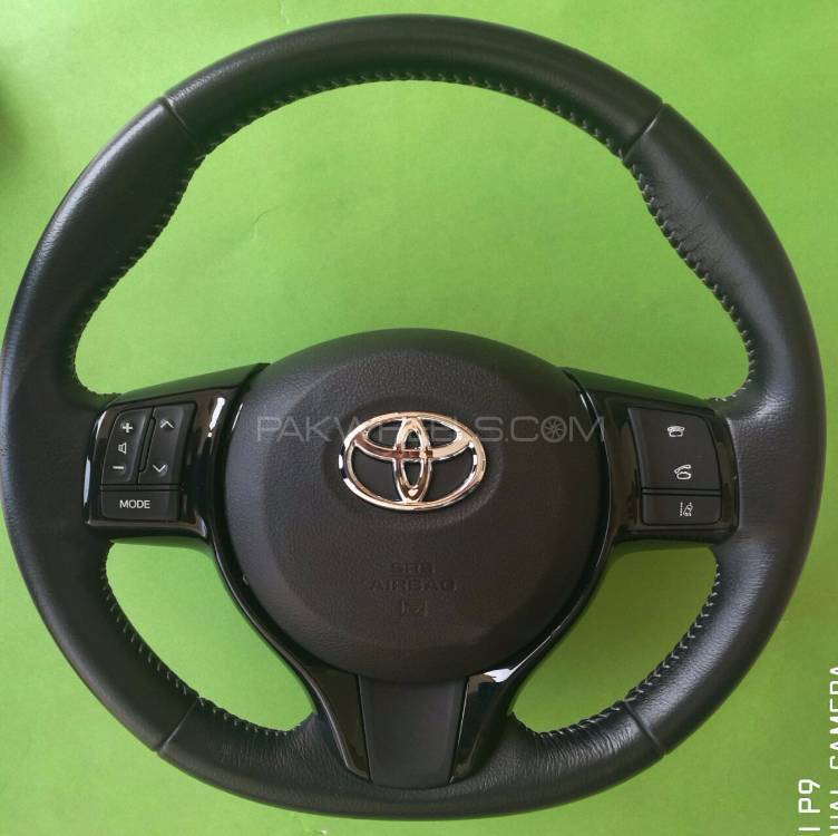 Toyota Vitz Multimedia Leather Stitch Steering Wheel Image-1