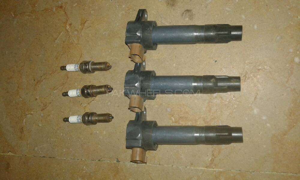 orignal ignition coils and spark plugs of Japanese alto Image-1