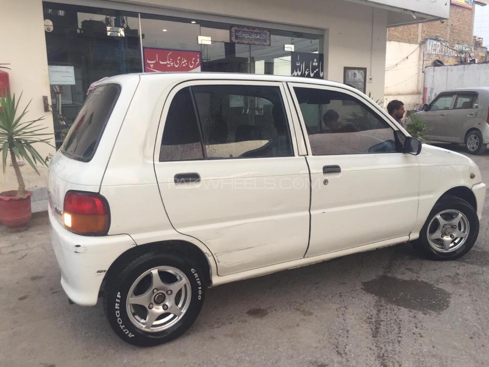Daihatsu Cuore 2004 for Sale in Peshawar Daihatsu Cuore 2004 for Sale in Peshawar Image-3