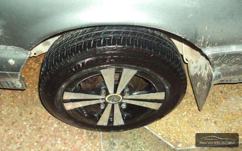 13'inch Bridgestone and Alloy Rims For Sale Image-1
