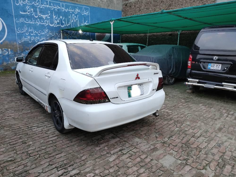 مٹسوبیشی لینسر - 2004  مٹسوبیشی لینسر - 2004  Image-6