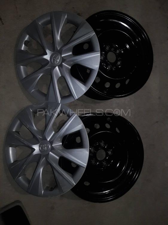 Toyota Corolla Gli Original Rim with covers Image-1