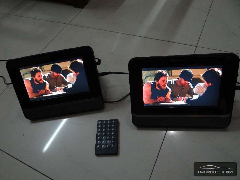 Dual Screen 7" Portable DVD Player For Sale Image-1