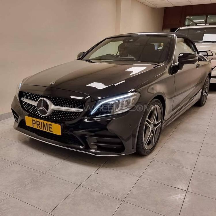 Mercedes Benz C200 Cabriolet
AMG Line Interior
AMG Line Exterior
Model 2019
Import 2022
Un Registered
Black
16000 Km
AMG IWC-Design Analogue Timepiece
Collision Warning System (Active Brake Application FCW-Stop)
Apple CarPlay/ Android Auto
Active Parking Assist
Adjustable Lumbar Support
Adaptive Highbeam Assist Plus
Active Engine Hood (Pedestrian Protection)
Ambient Cabin Lighting (Interior Light Package)
Agility Select (Dynamic Driving Mode Select)
AMG 18” Alloy Wheels
Automatic Dimming Mirrors
Automatic Rain Detection Windshield Wipers
Anti Theft Alarm System
Cruise Control
Collision Detection
Cabriolet Comfort Package
Ergonomics Package
Illuminated Door Sills
Knee Airbags
Keyless Start
Leather Super-Sports Steering Wheel
Heated/ Cooled Seats (Front + Passenger)
Heated/ Cooled Head Rests (Front + Passenger)
Paddle Shifters
Rear Seat Through Loading
Rear Seat Side Airbags
Soft Top (Black Headliner)
Sports Suspension
Tyre Pressure Monitoring 
Traffic Sign Recognition/ Assist
Touch