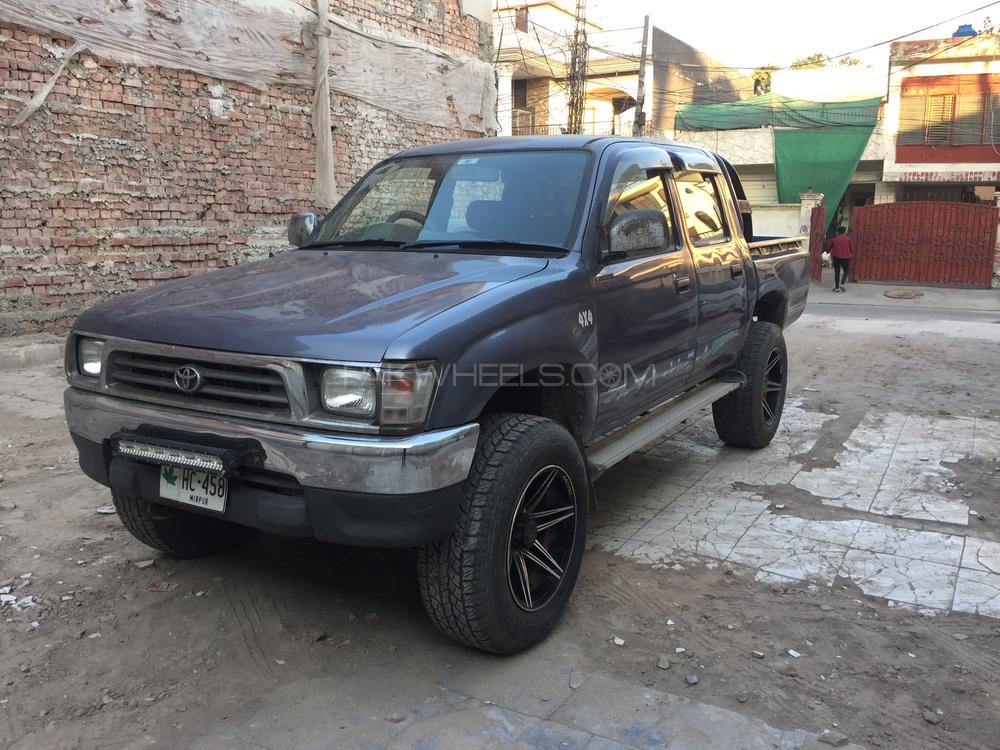 1999 maroon toyota hilux 4x4 pickup