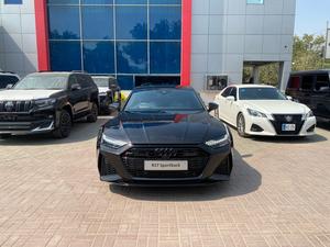 Audi RS 7 Sportback 
Quattro 4.0 V8 600hp
0-100 in 3.6 seconds 
Model: 2021 
Zero meter 
Unregistered 

Top of the line specs 
The only RS 7 of Pakistan
Audi Import

Some extra features:
*Power latching doors
*Head-up display 
*360 degree cameras 
*Valcona leather package with honeycomb stitching
*Glossy black appearance package 
*Sports seats plus in front 
*Ambient lighting package plus
*Instrument cluster 
*Audi music interface in the rear seat area
*Panoramic glass sunroof 
*Headliner in black fabric 
*HD matrix LED headlamps 
*Bang & Olufsen premium sound system with 3D sound 
*Audi phone box light